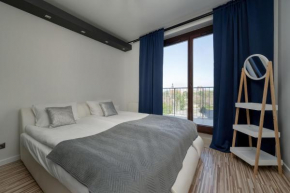 Spacious Apartment Located near Racławice Panorama by Noclegi Renters